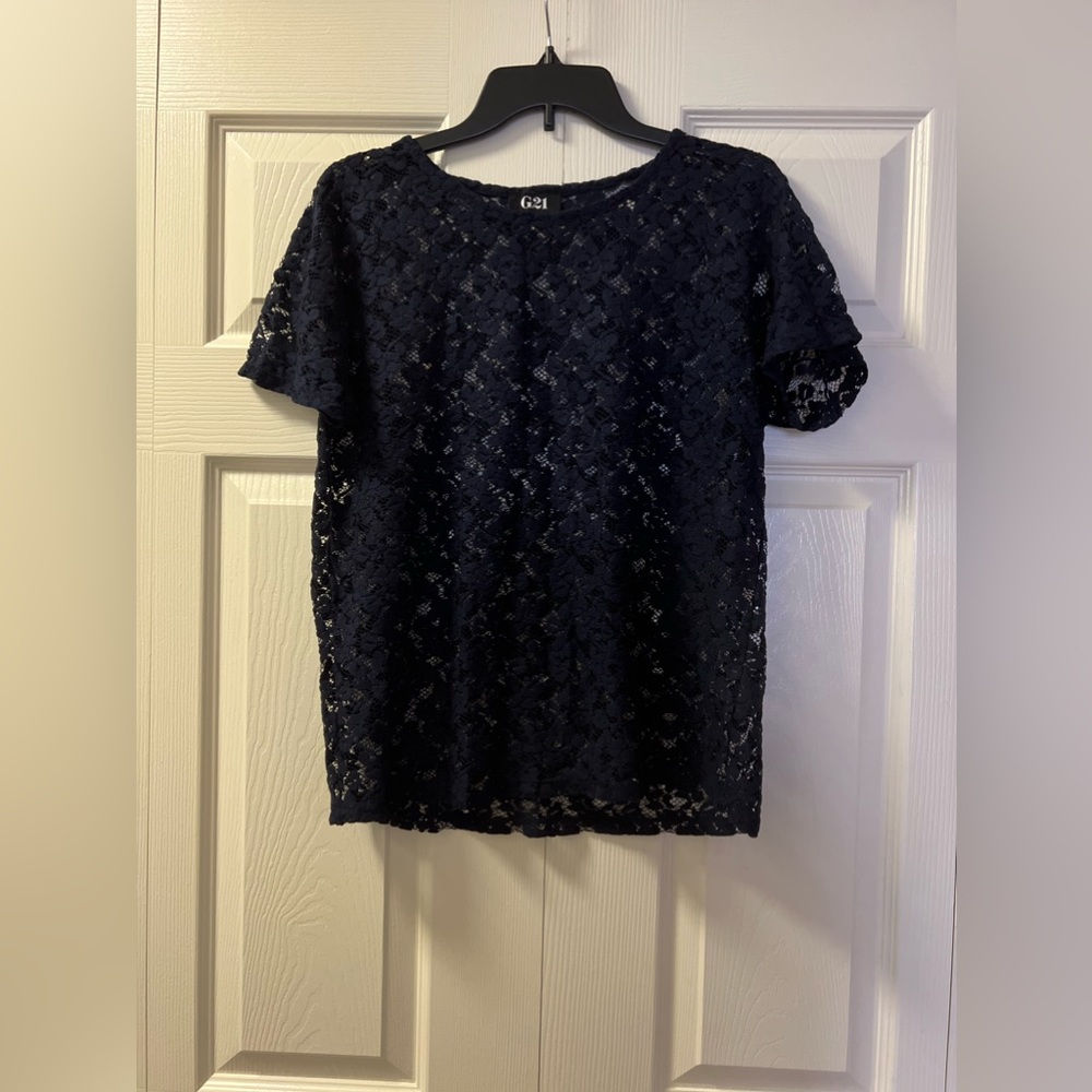 A navy top is a versatile wardrobe staple that can be dressed up.